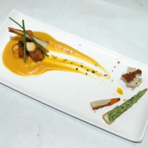 Grilled root vegetables with pumpkin puree.